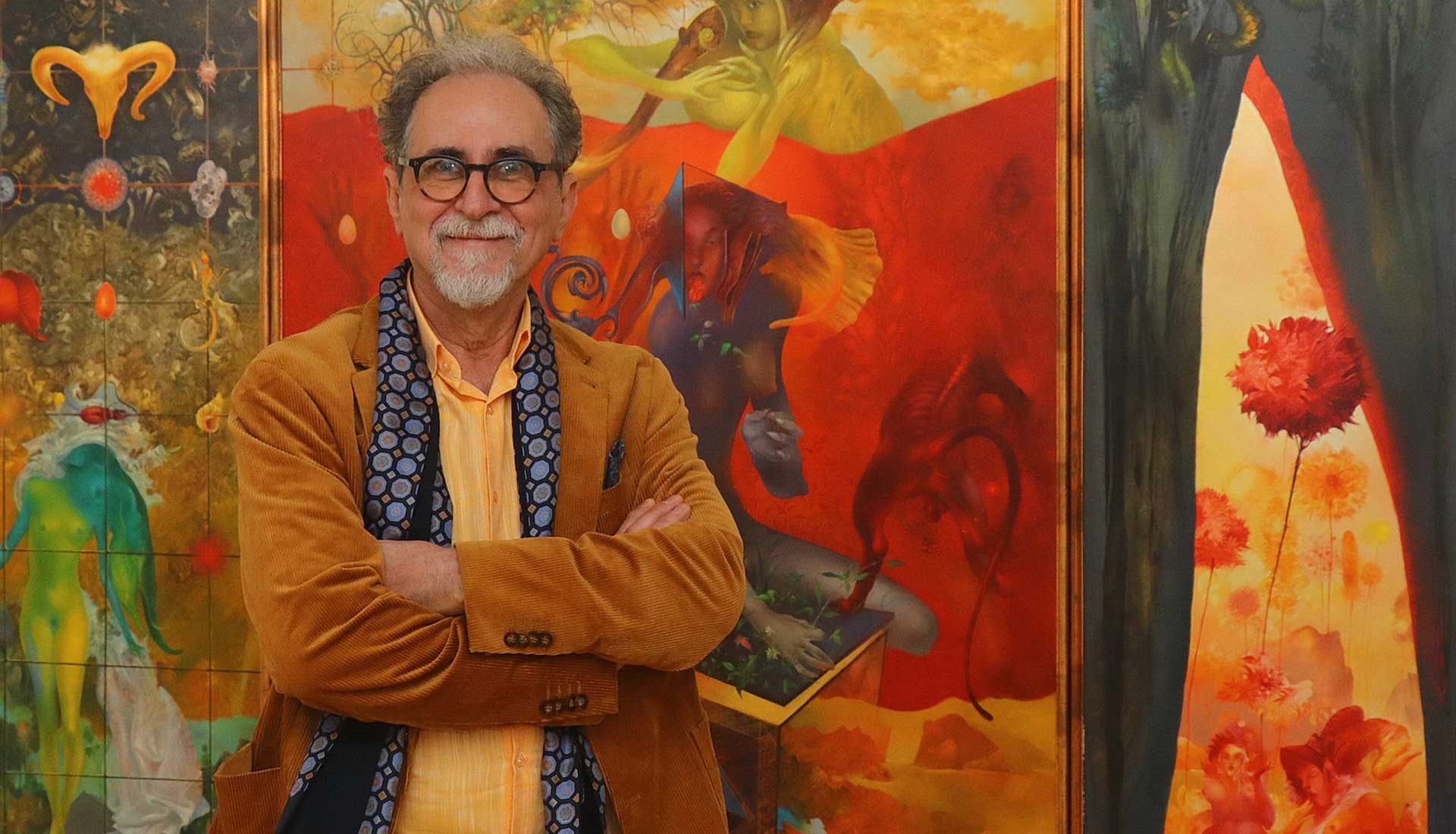Hero background: Portrait of artist Željko Đurović standing in front of his painting